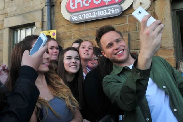 Photo: David Hurst
Ollie Murs takes selfies with fans at the studios of The Bay Radio, Lancaster.