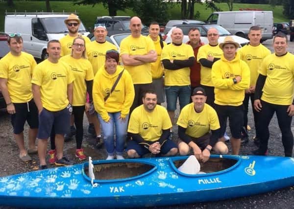 Rob Mayor, from Carnforth (second standing from right), and the team for the canoe challenge.