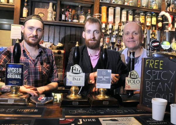 From left, Sam Warren, Mark Cutter and Mark Wildman provide free soup at The Robert Gillow in Lancaster