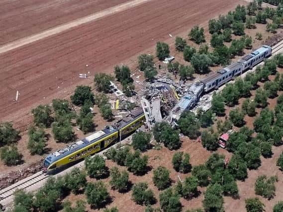 Two commuters trains after their head-on collision in the southern region of Puglia