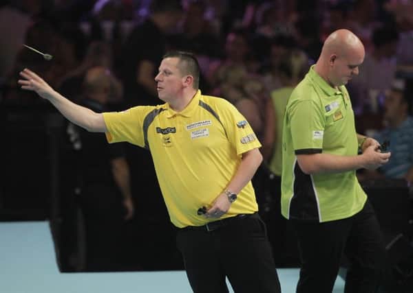Dave Chisnall in action against Michael van Gerwen in Blackpool.