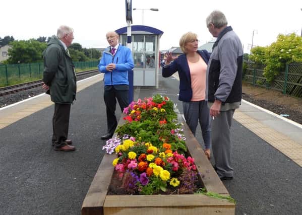 North West In Bloom Judges Brian Whalley and Malcolm Eubank were shown, despite the rain,  the splendour of Morecambe by David Croxall, clerk of Morecambe Town Council and Debs Gourlay, chairman of Morecambe Bloomers. Pictured here at Morecambe train station.
