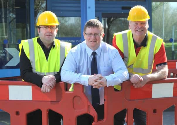 Coun Darren Clifford, Stuart Glover, sports facilities and development manager, and Simon Kirby, Sports and Leisure Manager at Lancaster City Council, at Salt Ayre Sports Centre, where work is well under way on a Â£5m upgrade