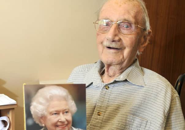 Norman Wilkinson with his 105th Birthday card from The Queen.