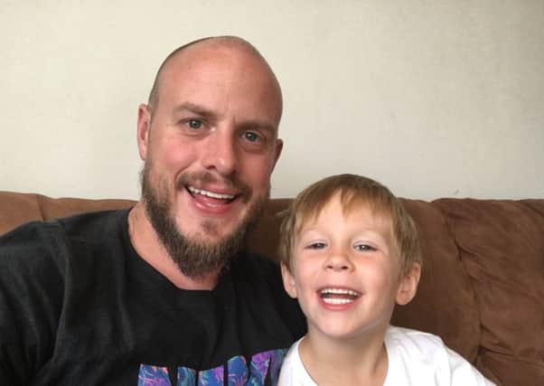 Luke Woodhouse with his son Travis.