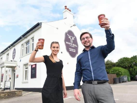 Brooklyn Atkinson and Alex Crawford celebrate the reopening of White Bull in Alston