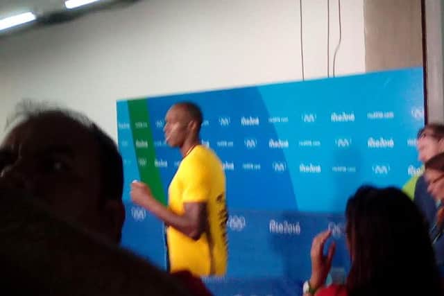 Dr John Davies snatched this photo of Usain Bolt as he passed him in the arena.