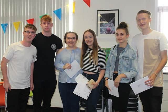 Heysham A-level students with their results.
