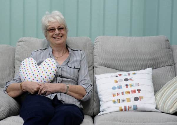 June Baker with her breast cancer pillow