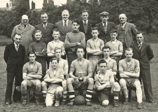 Freehold United FC - 1947-48 winners of the E G Smith Cup. Names of players only: middle row from left, Eric Salter (reserve goalkeeper), Colin Barker, Raymond Troughton, Donald Rutherford and Alan Baines. Front row from left, Ronald Parkinson, Frank Parkinson, Ken Topsy Irving (captain), Owen Westwood and Eddie Redhead.
Kneeling on the ground from left, Gordon Simpson and Jack Tiger Wilkinson.