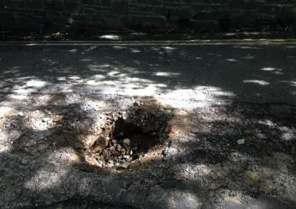 Richard Peregrine sent us this photo of a large pothole or sinkhole in Long Marsh Lane on Friday morning.