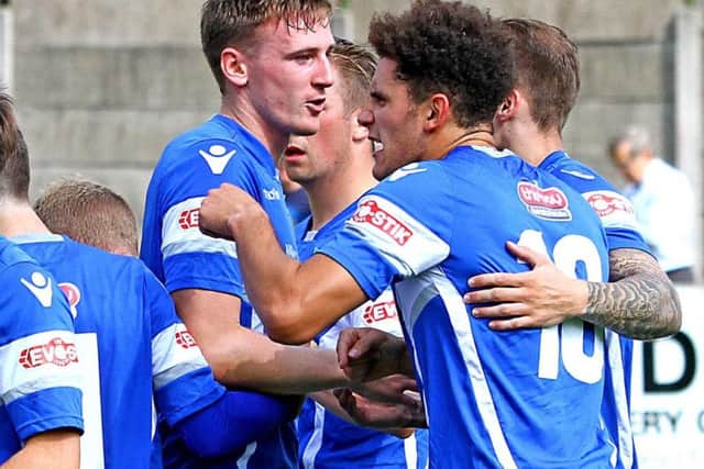Louis Mayers is congratulated after opening the scoring for Lancaster City. Picture: Tony North