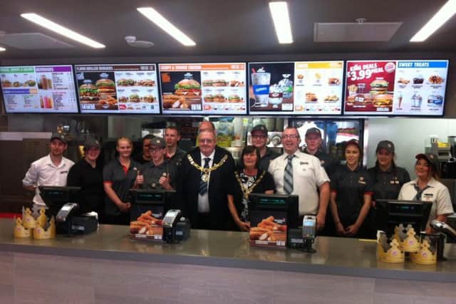 Coun Robert Redfern, mayor of Lancaster, and his wife Linda Redfern, the mayoress, with Burger King staff at the official opening on Saturday morning just hours before the burglary.