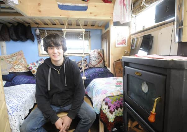 15-year-old Billy Walden with his camper van he restored himself