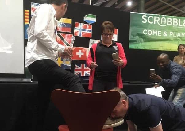 Daniel Stembridge from Morecambe kept his word over a bet to kiss the feet of Brett Smitheram should he win the World Scrabble Championships - which he did!
