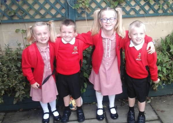 From left: Lily, Jude, big sister Rosie and Dylan. The triplets enjoyed their first day at school on Monday.