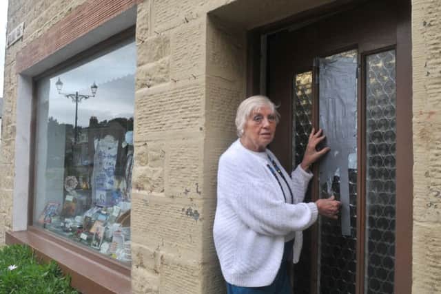 Kath Gregson outside her antique shop in Heysham that was damaged by vandals