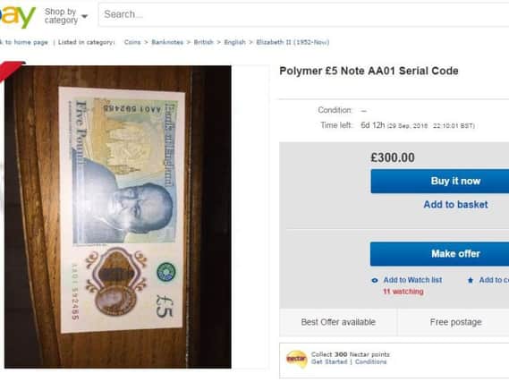 One of the new, lower-numbered notes for sale on an auction website