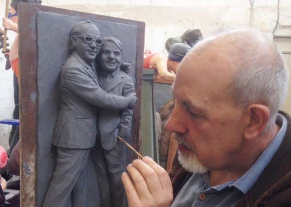 Graham Ibbeson working on a miniature 3D model of Eric and Ernie.