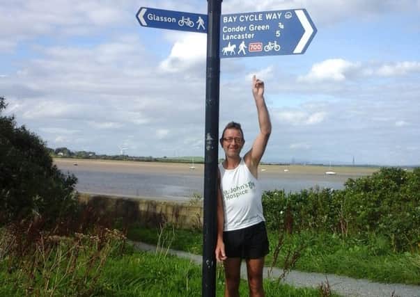 Mark Houghton during his run around the Bay Cycleway for St John's Hospice. Pictured here at the finish line at Glasson Dock.