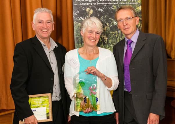 Caroline Jackson,leader of the Park Playground Project group at Williamson Park, receiving the Best Practice Award from the Lancashire Environmental Fund from Andy Rowatt, LEF Fund Manager and Mike Davison, SUEZ.