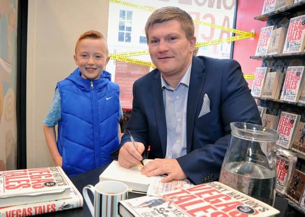Boxing legend Ricky Hatton at Preston Waterstone's book shop signing copies of his book Vegas Tales. Zack Fox is pictured with his hero.  PIC BY ROB LOCK 20-5-2015