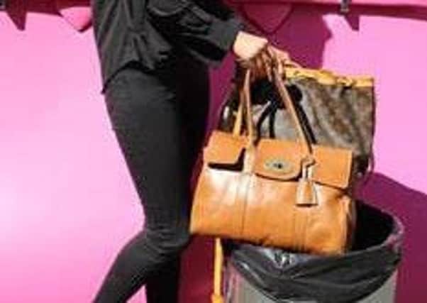 Charlotte Staerck, purchasing manager at Handbag Clinic with some genuine designer handbags.