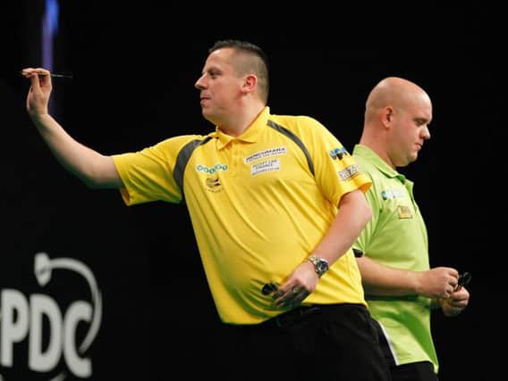 Dave Chisnall in action against Michael van Gerwen on Friday night. Picture: Lawrence Lustig/PDC