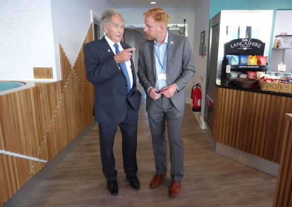 Cedric Robinson MBE, Queen's Guide to the Sands of Morecambe Bay, and Stuart Clayton, chief executive of Galloway's Society for the Blind, at the opening of the Brew Me Sunshine coffee shop at the former Visitor building.