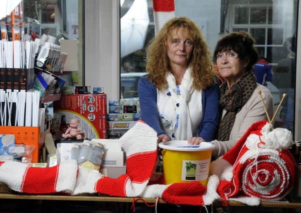 Barbara Boyd and daughter Vicky Boyd-Power from the Little Shop of Hobbies were left devastated when thieves broke in and stole a charity bucket