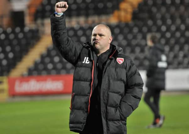 Jim Bentley salutes the travelling fans at the final whistle at Meadow Lane. Picture: B&O PRESS PHOTO