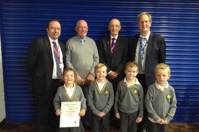 Councillor Darren Clifford, Michael Moorhouse from Morecambe in Bloom, Clerk to Morecambe Town Council David Croxall, headteacher at Great Wood School John Ross and children from Great Wood school who were presented with a bronze award in the Morecambe in Bloom schools competition.