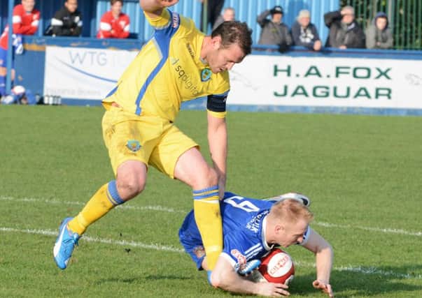 Lancaster City captain Ricky Mercer battles for the ball against Farsley Celtic. Picture:  John McEvoy/@rodleylife