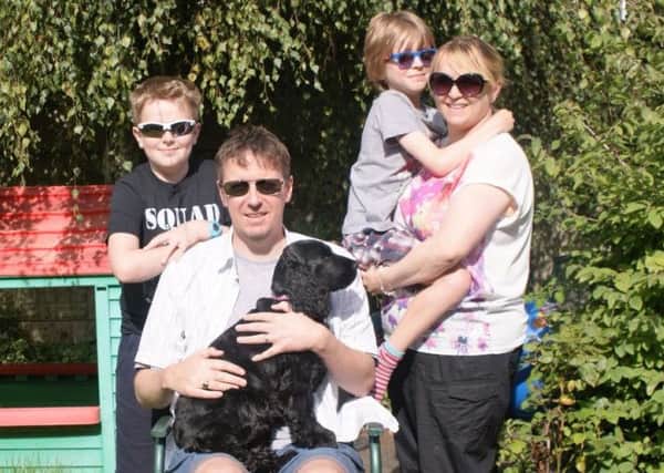 Mark Fitchett with his wife Emma, sons Will and Sam, and dog Milly.