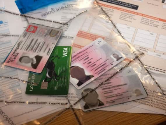 Some of the driving licences seized as part of a modern slavery operation. Pic: Northumbria Police.