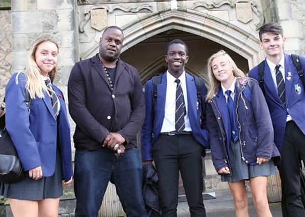Ripley pupils with Javone Prince during the filming for BBC2 programme The School That Got Teens Reading. Photo: BBC