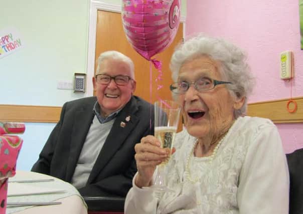 Mary Tranter with her brother Jack Bracewell toast Marys 104th birthday.
