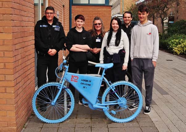 LMC Fabrication and Welding students with tutor Louise Boardly and PCs Arundale and Cornthwaite with one of the lock it or lose it bikes.