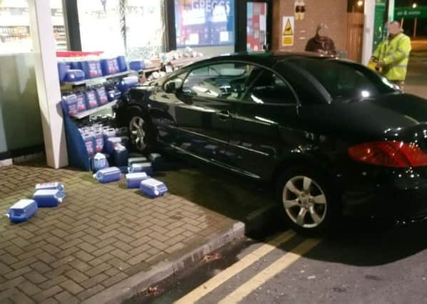 A car crashed into the filling station shop at Forton services. Pic: LancsRoadPolice