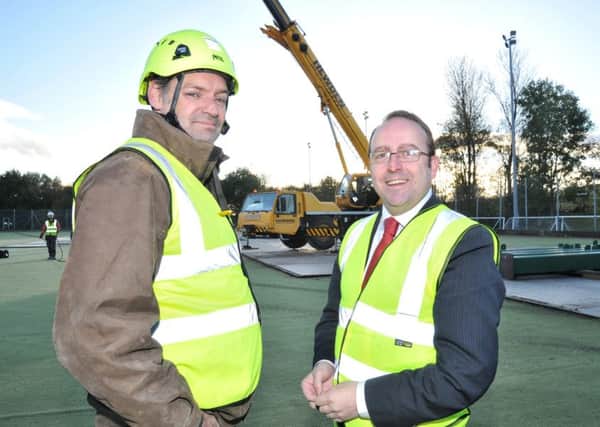 Picture by Julian Brown 07/11/16

Hangfast's John Beers and Lancaster City Council's Darren Clifford pictured on site as work starts on 'Flight Tower' - an outdoor high ropes abseil and climbing attraction - being installed at Salt Ayre Sports Centre, Lancaster