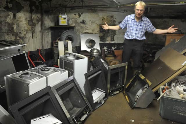 Aftermath of the unprecedented flooding over the weekend in Lancaster.
The storage cellars of Fireplace Warehouse near Skerton Bridge were completely inundated, destroying approximately Â£20,000 of stock.
Owner Bob Whitehead with some of the ruined stock.  PIC BY ROB LOCK
7-12-2015