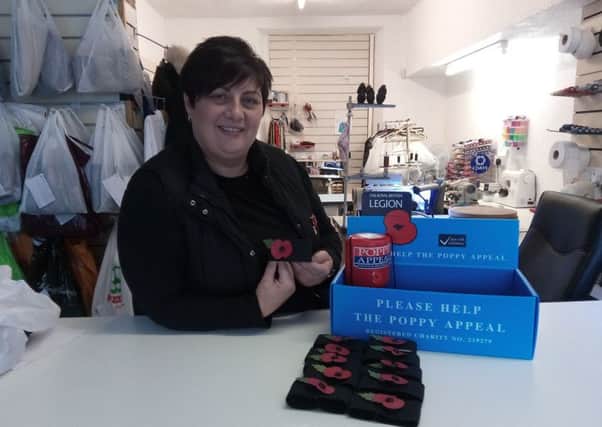 Jeanette Morgan with some of the poppy armbands she has made. So far she has had requests for up to 1200 of the armbands. Teams pay a suggested donation of 50 pence per armband so Jeanette could raise up to Â£600 for the Royal British Legion poppy appeal.