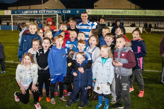 Neil Marshall with some young fans at the end of his testimonial.  Picture: Gavin Haworth.