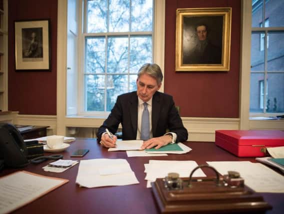 Chancellor of the Exchequer Philip Hammond reads through his Autumn Statement in his office in 11 Downing Street, London