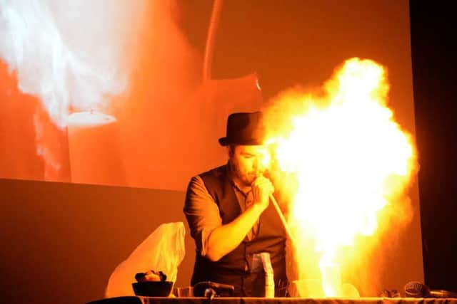 Phil Bell-Young performing one of his magic tricks during the performance. Photo by Darren Andrews.