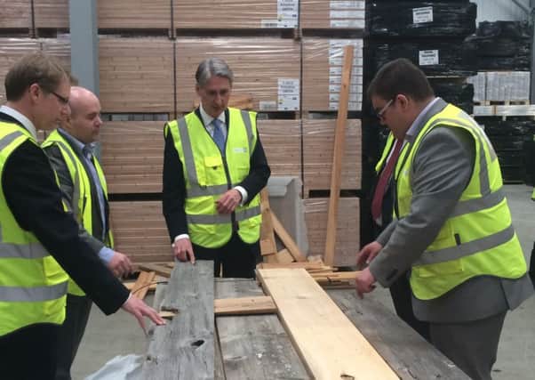 Philip Hammond on a visit to Havwoods flooring company in Carnforth.