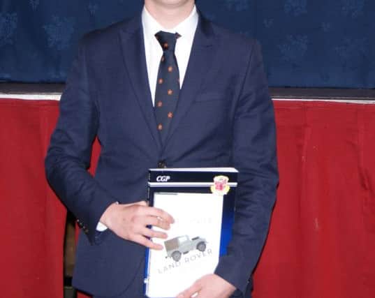 Ben Heseltine with his award.