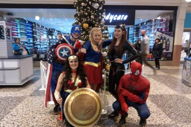 Town councillor Tracy Brown as Wonderwoman (front with shield), with back row: Terry Jobson as Captain America, Rebecca Tordoff as Superwoman, Eva Brown as Catwoman and front right, Dylan Vity as Spiderman at the Arndale Christmas lights switch on.