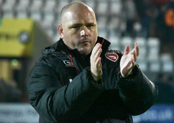 Jim Bentley salutes the fans at the final whistle after their win over Plymouth.