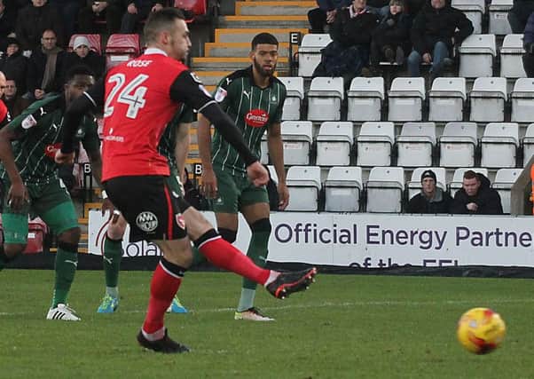Michael Rose scores from the spot against Plymouth.